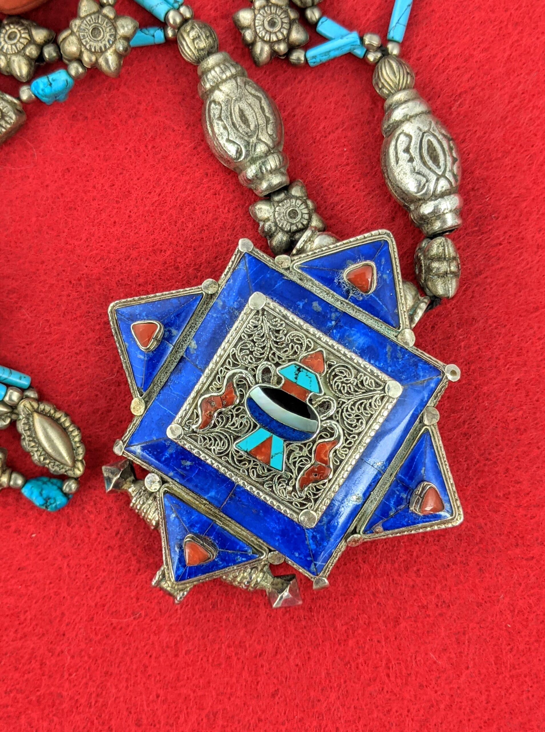 Lapis lazuli pendant on necklace.