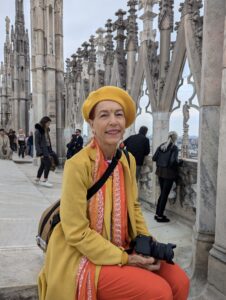 Woman sitting in the Duomo of Milan, Italy.